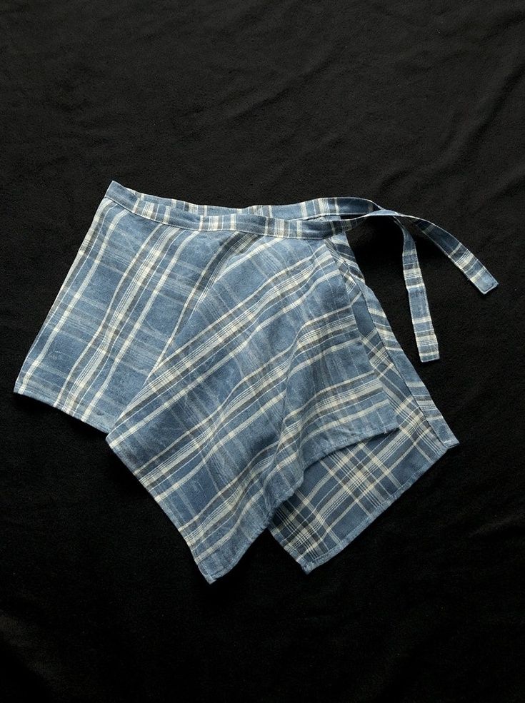 Blue Plaid Wrap Flowy Wrap Skirt | IU Blue One Size Summer Cotton Mini Wrap Skirt, Chic Blue Cotton Skirt, Casual Tie Waist Mini Wrap Skirt, Summer Fitted Indigo Bottoms, Casual Wrap Skirt With Tie Waist For Day Out, Blue Fitted Wrap Skirt For Casual Wear, Light Blue Summer Skirt With Pockets, Blue Tie Waist Shorts For Spring, Blue Shorts With Tie Waist For Spring