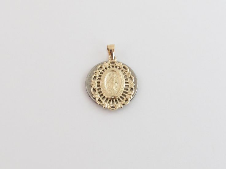 "Fabulous 14k Yellow Gold Virgin Mary Charm Pendant! Metal Purity: 14k Solid Gold , Stamped , Not plated Length: 3/4\" or 20 mm long Width: Almost 5/8\" or 15 mm wide Weight: 1.50 grams Complementary Gift Box There is a prayer around Mary which says: O Mary conceived without sin pray for us who have recourse to thee. This pendant is about the same size as a dime. Images may be enlarged to show detail and the item may look larger than it appears in person.In order to reduce buyer remorse and retu Elegant Commemoration Jewelry With Charms, Commemorative White Gold Jewelry With Charms, Gold Jewelry With Miraculous Medal For Memorial, 14k Stamped Medallion For Anniversary, Gold Miraculous Medal Jewelry For Memorial, Yellow Gold Miraculous Medal Jewelry For Wedding, Wedding Yellow Gold Jewelry With Miraculous Medal, Round Pendant Jewelry With Hallmark For Commemoration, Anniversary Miraculous Medal Round Pendant Jewelry