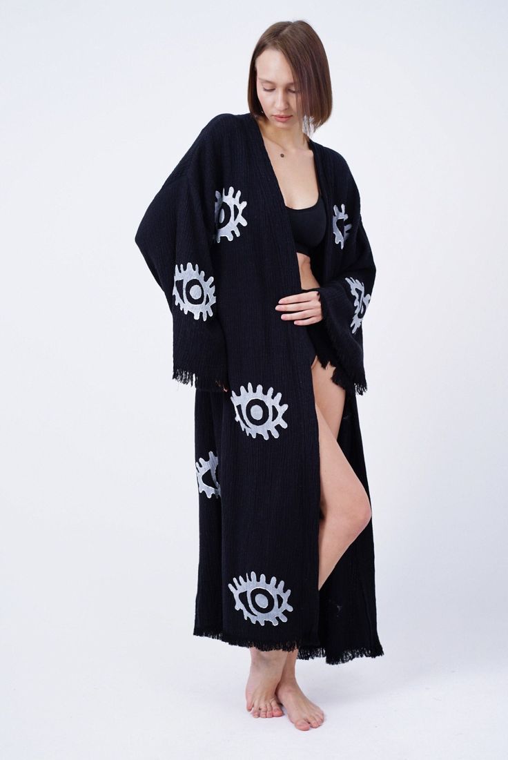 Introducing our exquisite organic cotton Handmade Evil Eye Boho Festival Kimono, a mesmerizing blend of bohemian elegance and spiritual symbolism. Handcrafted with love and care, this kimono is a stunning addition to your festival wardrobe, offering both style and positive energy. Our bohemian kimono, which is made of 100% handmade high quality cotton fabric, can be used as a pareo in daily life or on the beach. (Made in Turkey) All of our ultra soft products are OEKO-TEX Standard 100 Certified. Make sure to wash our eco-friendly kimono, which is 100% handmade, once before using it. You can machine or hand wash it delicately and please do not use bleach or fabric softener. When you wear the quick-drying kimono, you can feel its soft texture on your skin. The kimono, which contains Anatolia Long Cotton Cardigan For Festival, Cotton Wrap Kaftan, Bohemian Cotton Cardigan For Loungewear, Bohemian Wrap Cardigan For Beach, Bohemian Wrap Cardigan For The Beach, Bohemian Cotton Kimono For Festival, Bohemian Beach Cardigan With Kimono Sleeves, Cotton Bohemian Kimono For Festival, Bohemian Cardigan With Kimono Sleeves For Beach