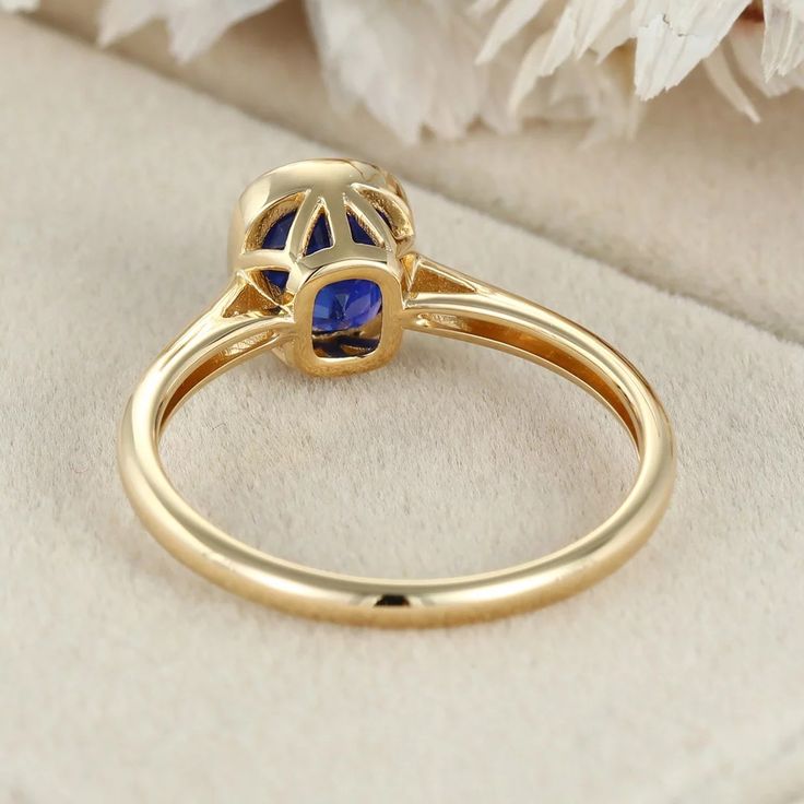 Indulge in luxury with our 14K Yellow Gold Cushion Cut Blue Sapphire Ring for Women. This captivating piece combines opulence and sophistication, featuring a mesmerizing blue sapphire gemstone elegantly set in lustrous yellow gold. Luxury Sapphire Cushion Cut Ring, Luxury Royal Blue Sapphire Ring, Gold Sapphire Ring With Cushion Cut, Gold Cushion Cut Sapphire Ring, Luxury Yellow Gold Sapphire Cushion Cut Ring, Elegant Gold Sapphire Ring With Cushion Cut, Luxury Round Sapphire Ring, Elegant Royal Blue Sapphire Ring With Center Stone, Gold Cushion Cut Sapphire Ring Fine Jewelry