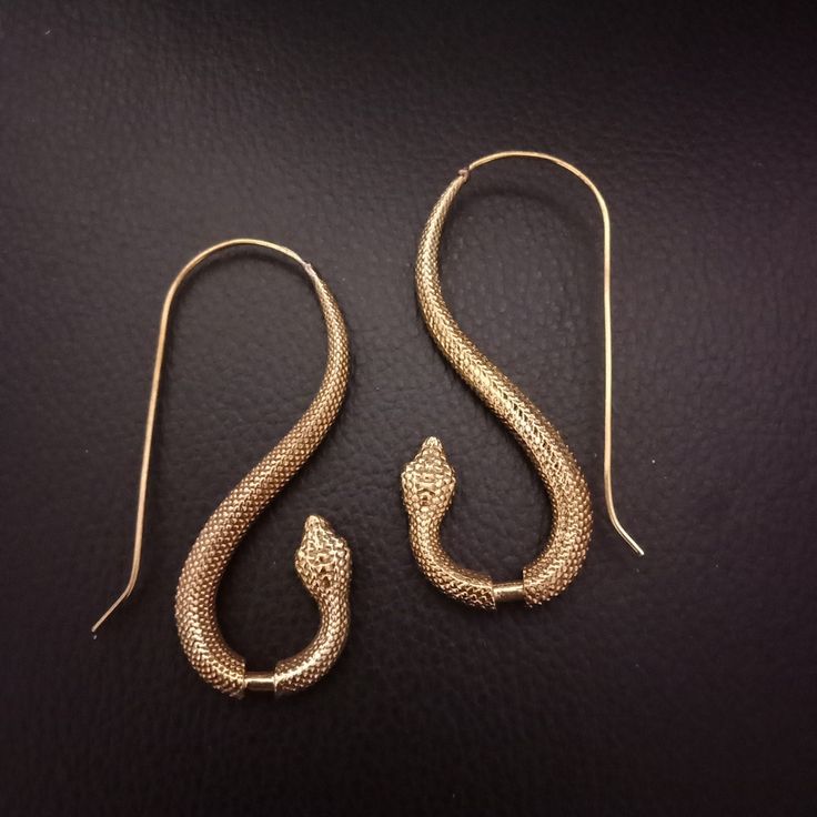 Snake Earrings in Brass.  Silver colour plated is Brass with Plated Silver. Dimension (approx): Total drop: 5.7 cm Width: 2.5 cm Adjustable Brass Snake-shaped Jewelry, Unique Snake-shaped Metal Jewelry, Unique Metal Jewelry With Snake Shape, Handmade Snake-shaped Brass Jewelry, Nickel-free Snake-shaped Jewelry Gift, Handmade Brass Snake-shaped Jewelry, Handmade Brass Snake Jewelry, Handmade Brass Snake Shaped Jewelry, Nickel-free Unique Snake-shaped Jewelry