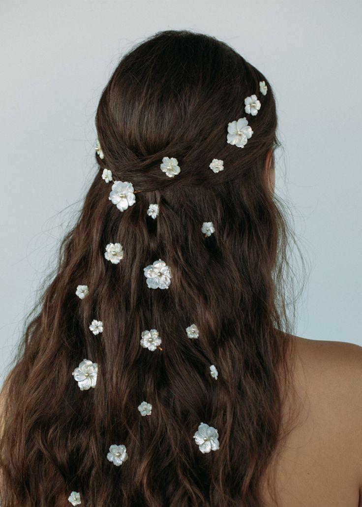 The Zinnia Bobby Pin Set, crafted in ethereal mother of pearl, is the key to creating dreamy hair looks. The set features five bobby pins in varying sizes. Each pin consists of an intricately carved mother of pearl flower and a small central pearl. We love scattering the pins throughout the hair or arranging them on a few strands of pulled back hair. Explore more bobby pins for styling inspiration. Dreamy Hair, Luxury Hair Accessories, Crochet Hair Accessories, Jennifer Behr, Styling Inspiration, Bobby Pin, Hoco Hair, Luxury Hair, Blue Bridesmaids