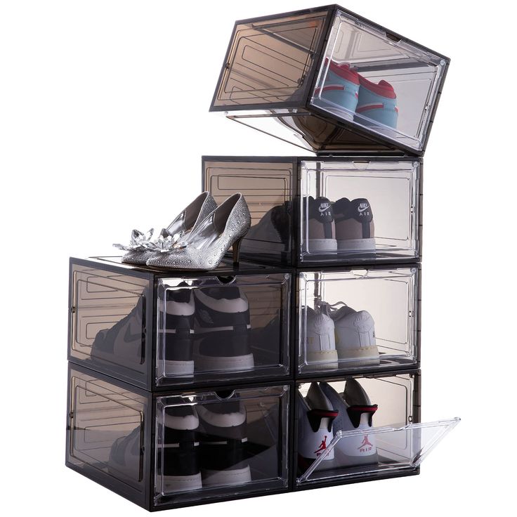 four clear storage boxes with shoes in them stacked on top of each other and the bottom is open