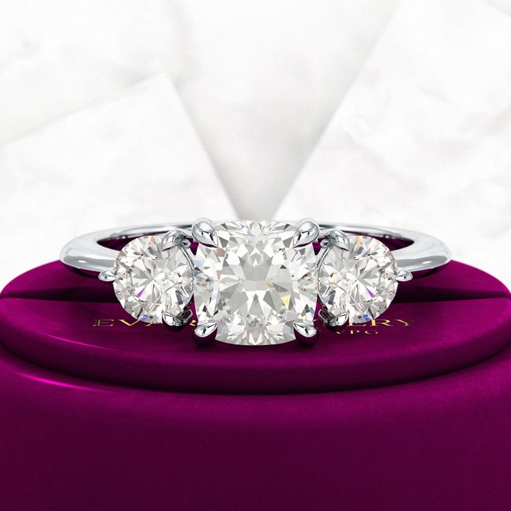 Celebrate Thanksgiving with our stunning 1.50 Carat Cushion Cut Lab Grown Diamond Engagement Ring. Adorned with sparkling round accent stones, this elegant cathedral band symbolizes everlasting love. Crafted from eco-friendly, conflict-free diamonds, it’s the perfect choice for weddings or anniversaries. Make this holiday season memorable by gifting a timeless piece that embodies both beauty and commitment. Elevate your love story with this exquisite ring, designed to be cherished for generation Luxury Diamond Ring With Vs Clarity Round Cut, Luxury Round Cut Diamond Ring With Vs Clarity, Luxury Vs Clarity Round Cut Diamond Ring, Cushion Cut Lab Grown Diamond In White Gold, Timeless Vs Clarity Lab Grown Diamond Ring, Luxury Vs Clarity Lab Grown Diamond Ring, Vs Clarity Lab Grown Diamond Ring, Vs Clarity Lab-grown Diamond Ring, Lab Grown Diamond Wedding Ring With Cushion Cut