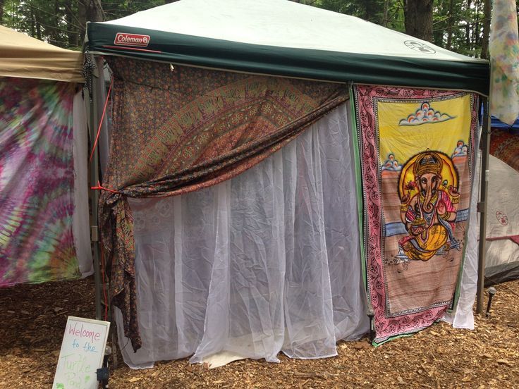 there is a tent that has been set up in the woods for an outdoor event