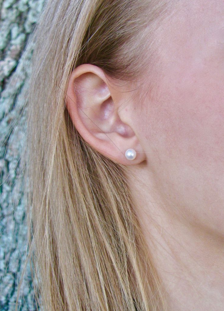 Simple, elegant and classic real pearl stud earrings created with white 5.5mm ROUND genuine freshwater pearls and nickel-free sterling silver stud posts. These are perfect earrings to coordinate with any of the 5.5mm pearl bracelets or necklaces in my shop. This size is appropriate for adults who want a smaller everyday pearl or older children age 6 and up (choking hazard for young children). Arrives on an earring card tucked inside a small gift box. O T H E R . O P T I O N S ~Gold-filled posts: Classic Round Pearl Earrings For Everyday, Classic Pearl Drop Earrings, Classic Everyday Nickel Free Pearl Earrings, Classic Nickel-free Pearl Earrings, Everyday Hypoallergenic White Gold Pearl Earrings, Classic Silver Pearl Earrings For Everyday, Classic Hypoallergenic Pearl White Pearl Earrings, Everyday Round Hypoallergenic Pearl Earrings, Everyday Hypoallergenic Round Pearl Earrings