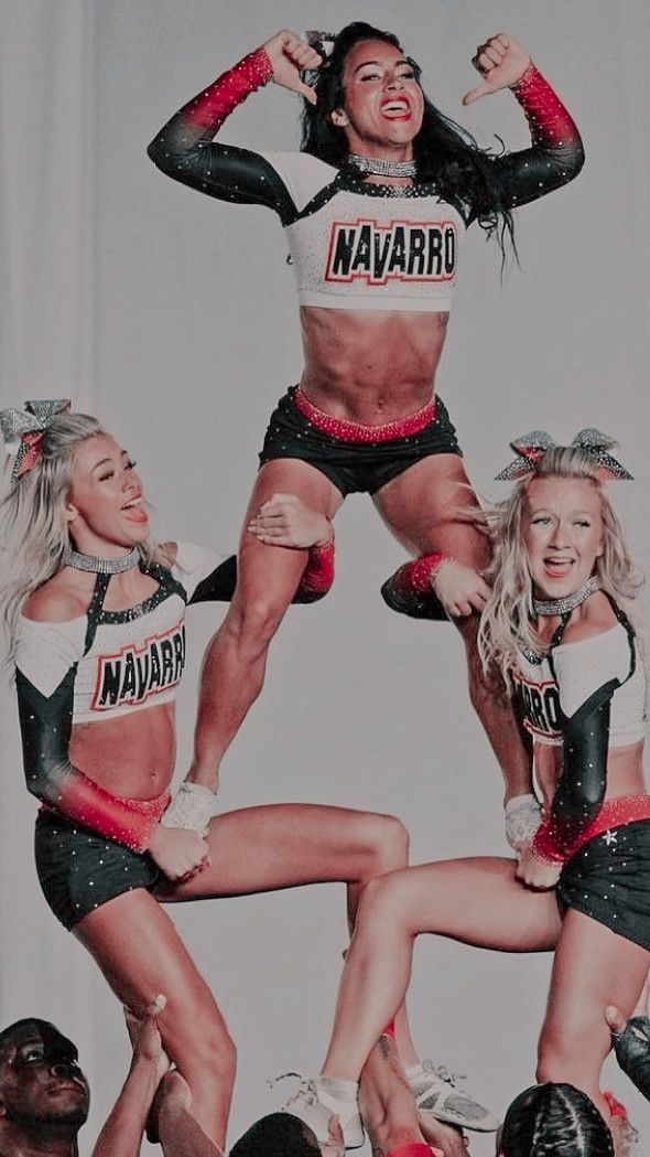 three women in cheerleader outfits are posing for the camera with their hands on their hipss