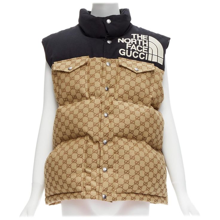 GUCCI THE NORTH FACE black beige big logo GG monogram padded vest jacket IT40 S Reference: LNKO/A02178 Brand: Gucci Designer: Alessandro Michele Collection: The North Face Material: Cotton, Polyester Color: Beige, Black Pattern: Monogram Closure: Snap Buttons Lining: Red Fabric Extra Details: GG monogram throughout back. Padded with goose down. Orange fabric lined. Made in: Italy CONDITION: Condition: Unworn in mint condition, with tags. Never used but micro scratches on buttons. Comes with: Sty Designer Jackets For Men, Gucci Jacket, Cool Coats, Padded Vest, Black Men Fashion Swag, Gucci Designer, Gg Monogram, Orange Fabric, Black Men Fashion