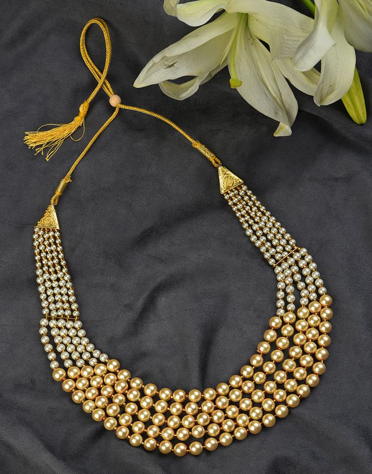 Jewellery sets always form an integral part of a woman’s dressing. It helps to provide a final touch to make the look complete. Consisting of a necklace, matching earrings, this necklace set glams up your look and makes you feel special. Polished Metal Beads Jewelry For Party, Party Jewelry With Polished Metal Beads, Elegant Metal Necklaces With Polished Beads, Party Necklace With Gold Beads, Gold Pearl Necklace With Polished Beads For Party, Gold Multi-strand Jewelry With Polished Beads, Elegant Beaded Chain Bridal Necklace For Festive Occasion, Elegant Bridal Necklace With Beaded Chain For Festive Occasion, Long Necklace With Gold Beads For Jewelry Making