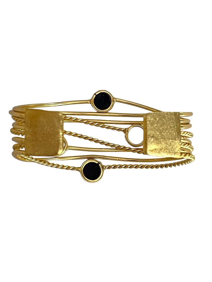 Stylish and refined, Bal golden wrist cuff which translates for Power, is perfect for occasion wear and every day luxury. Dipped in gold, the design features a delicate design studded with Black Obsidian. Two rows of ivory Pearls around the circumference conclude the design. This bangle is a treat to watch and own! Luxury Brass Bangle Bracelets, Luxury Brass Bracelets For Formal Occasions, Luxury Brass Bangle Bracelet, Elegant Gold Brass Cuff Bracelet, Elegant Yellow Gold Brass Cuff Bracelet, Luxury Brass Bangle, Luxury Brass Oyster Bracelet, Elegant Gold Brass Bracelet For Formal Occasions, Elegant Formal Gold Brass Bracelet