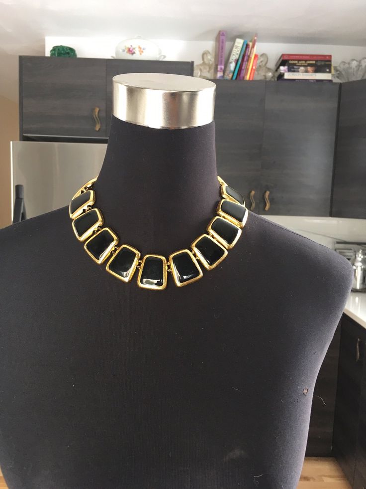 "Beautiful Anne Klein statement necklace. Modernist design in a shiny gold tone and black enamel featuring a toggle closure. CONDITION In excellent vintage condition. No wear, marks or damage. Closures are all secure The necklace measures approximately 17 3/4 inches and 1 1/8\" wide. The necklace is signed with © Anne Klein on one side of the tag and the lion's head on the underside. The necklace is also signed ©AK on a cartouche on one link. It is in excellent vintage condition Please see this Gold Necklace With Black Enamel For Formal Occasions, Modern Gold Necklace With Black Enamel, Vintage Black Enamel Jewelry, Black Vintage Enamel Jewelry, Retro Black Necklaces For Party, Retro Black Necklace For Formal Occasions, Retro Black Metal Necklace, Retro Black Jewelry For Formal Occasions, Formal Black Enamel Necklaces