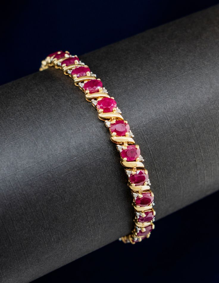 "Vintage 14k Yellow Gold Ruby and Diamond Tennis Bracelet Metal: 14 karat Yellow Gold Stones: Rubies at 13.5 carats total, Diamonds at 0.32 carat total. Length: 7\" Width: 5.3mm  Figure 8 Safety Latch  Box Clasp" Yellow Gold Ruby Tennis Bracelet For Anniversary, Ruby Tennis Bracelet In Yellow Gold For Anniversary, Anniversary Ruby Tennis Bracelet In Yellow Gold, Yellow Gold Diamond Bracelet With Gemstone, Diamond Gemstone Tennis Bracelet For Anniversary, 14k Gold Gemstone Tennis Bracelet In Fine Jewelry Style, 14k Gold Gemstone Tennis Bracelet, 14k Gold Tennis Bracelet With Gemstones For Formal Occasions, Elegant Ruby Tennis Bracelet In Yellow Gold