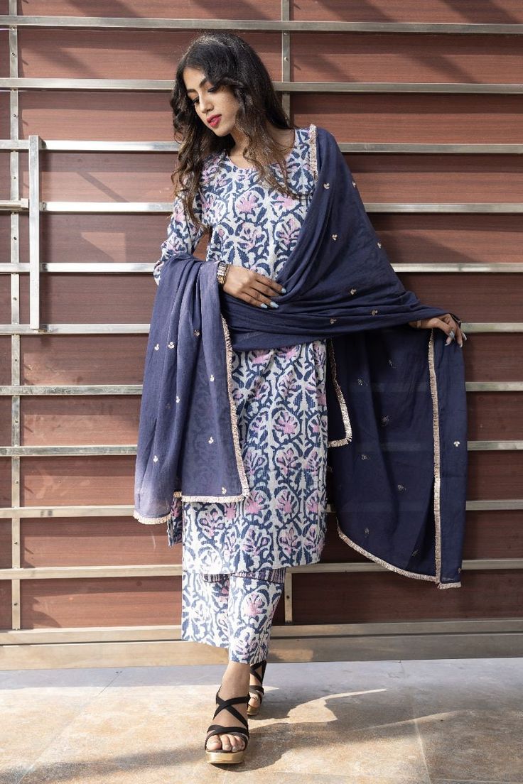 This indigo and pink suit set is a perfect summer vibe comfort wear. The mul-mul dupatta is embroidered with gota work. Cotton Palazzo Set With Gota Work, Cotton Palazzo Set With Gota Work For Eid, Cotton Straight Kurta With Gota Work, Unstitched Cotton Dupatta With Gota Work, Cotton Unstitched Suit With Gota Work For Festivals, Cotton Dupatta With Gota Work, Eid Cotton Dupatta With Gota Work, Blue Cotton Block Print Unstitched Suit, Blue Cotton Unstitched Suit With Block Print