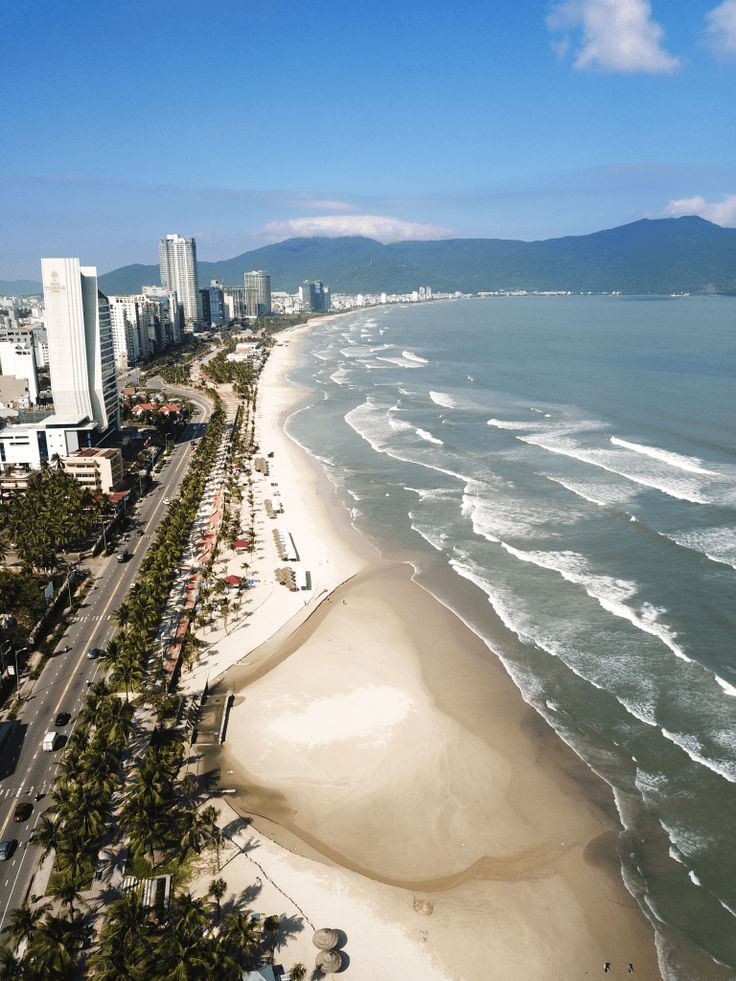 an aerial view of the beach and ocean with text that reads danang the complete guide