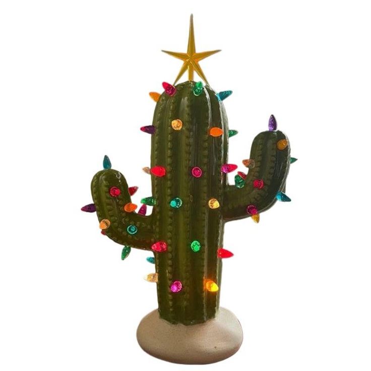 a green cactus with colorful lights on it