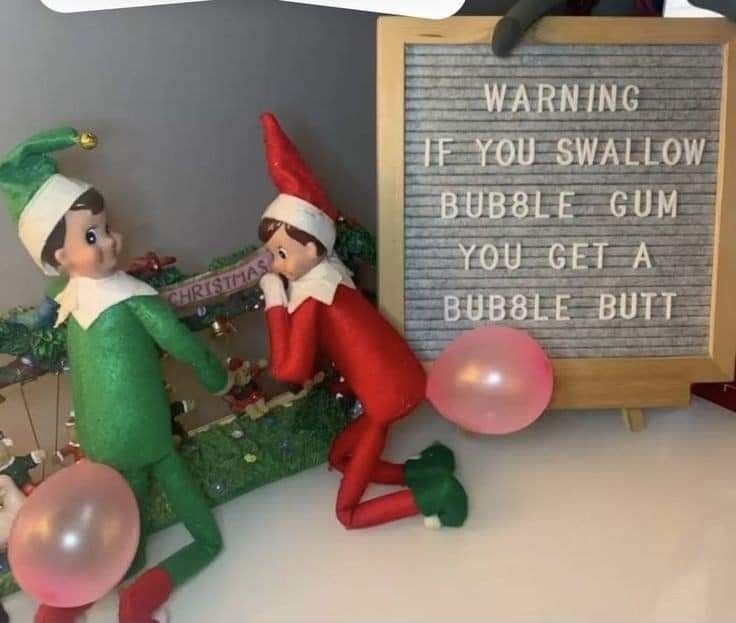 two elfs are playing with bubbles in front of a sign that says, warning if you