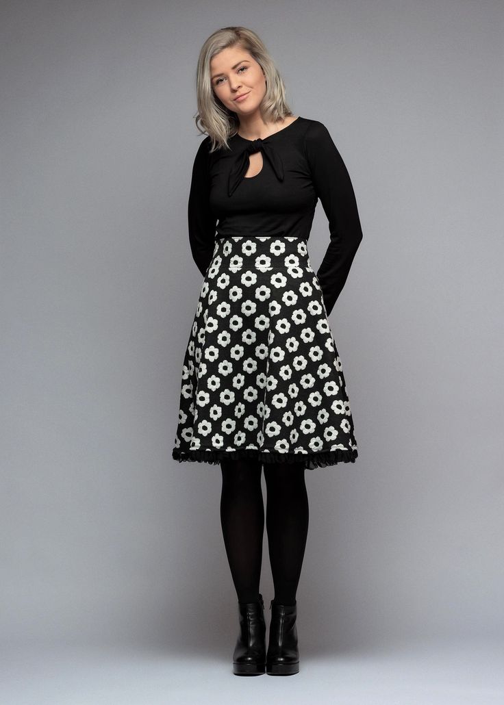 With a high waistband and large retro flowers, the skirt has a trendy modern vintage look.  The black waist skirt is made of soft, stretchy French terry with white large retro flowers. The plate-shaped skirt always cuts a fine figure thanks to its wide swinging skirt and wide waistband. The hem ends with a wide, transparent ruffled border in black.  Simple and yet a little playful.  Hannah wears size S Sizing: BU/TU/HU(+-2cm)  34(XS) 86/66/86  36(S) 90/70/90  38(M) 94/74/94  40(L) 98/78/98  42(XL) 102/82/102  44(XXL) 106/86/106  Total length 34-38 : 60cm Total length 40-44 : 62cm We are also happy to manufacture according to measurements.  Material&Care:  French Terry: 60%cotton, 40%polyester W30o Weiberstyle stands for real handwork made in Austria. Each piece is designed with a lot of lo Retro Black A-line Skirt, Retro Flared Skirt With Floral Print, Black A-line Retro Skirt, Black Retro A-line Skirt, Retro Black Flared Skirt, Retro Floral Print Mini Skirt, Retro Mini Skirt With Floral Print, Retro Black Skirt For Spring, Retro Black Lined Skirt