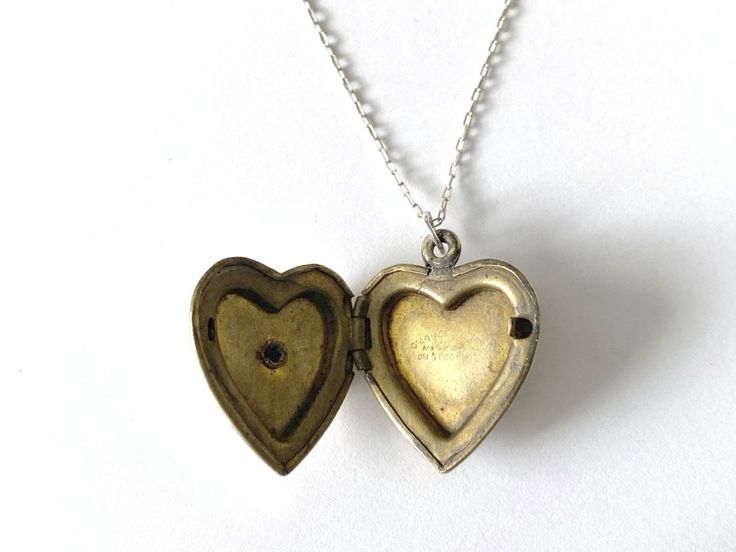 This vintage sweetheart necklace bears a US Navy insignia on a heart-shaped locket. The locket is hallmarked 10K gold-filled sterling from D'Aguanno Bros. The chain is a new, 14K gold-filled, and measures 18 inches. This piece has been restored as close as possible to its original condition, cleaned gently by hand with steam, polishing cloths, and good old-fashioned elbow grease.This vintage item has been loved and cherished by a previous owner, there will be some slight wear or imperfections. I Navy Insignia, Necklace With Picture, Sweetheart Jewelry, Heart Shaped Locket, Hope Design, Heart Locket, Us Navy, Art Project, 10k Gold