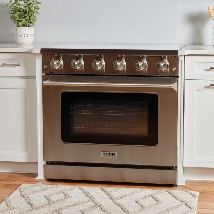 an oven with the door open in a kitchen