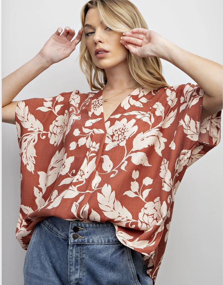 Let your style bloom with our Masie floral print top. With a flattering v neck, flowy kimono sleeves, and stylish side slits, this loose top will keep you looking and feeling fresh. Perfect for a playful and laid-back look! oversized (xl can easily do a large) Trendy Oversized V-neck Blouse, Patterned Printed V-neck Blouse, Oversized Versatile V-neck Blouse, Versatile Oversized V-neck Blouse, Trendy V-neck Floral Print Blouse, Patterned Floral Print V-neck Top, Casual Short Sleeve V-neck Top For Brunch, Chic Floral Print V-neck Top, Versatile V-neck Blouse For Beach