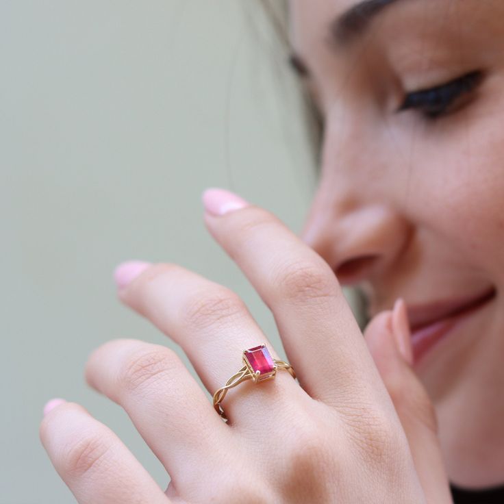 "This vintage inspired ring is set with a beautiful pink Ruby to make you feel like a princess A dainty and unique Celtic pattern to encircle your finger. Handmade by an inspired jewelry artist team with decades of experience in the craft of jewelry making. Each gemstone, each diamond is carefully picked. Using only the finest raw materials and the highest industry standard in manufacturing, design and finish. Set with a 7x5 Octagon cut Pink Ruby 1.06 ct All ring sizes available, if you cannot f Delicate Emerald Cut Promise Ring, Delicate Pink Jewelry With Rose Cut Diamonds, Delicate 14k Gold Pink Ring, Dainty Pink Stackable Rings For Wedding, Elegant Pink Diamond Ring In 14k Gold, Delicate Pink Rings With Rose Cut Diamonds, Delicate Pink 14k Gold Rings, Fine Jewelry Pink Ruby Ring For Proposal, Pink Ruby Ring For Proposal In Fine Jewelry Style