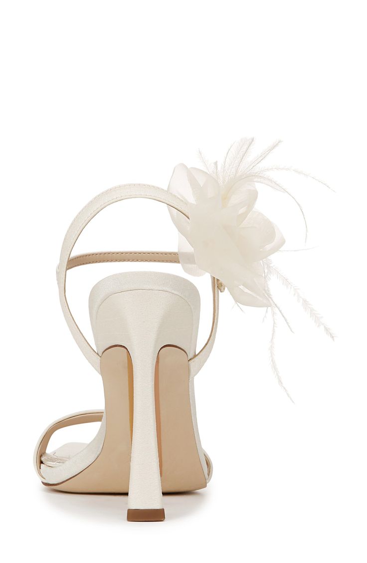 A whimsical floral appliqué enriches the ankle of an occasion-ready sandal framed by an angular square toe and flare heel. 4 1/2" heel (size 8.5) Adjustable ankle strap with buckle closure Textile upper and lining/rubber sole Imported Summer Wedding Shoes With Sculpted Heel, Cream Heels For Spring Events, Wedding Heels With Sculpted Heel And Single Toe Strap, Square Toe Sandals For Wedding In Spring, Square Toe Sandals For Summer Wedding, Cream Square Toe Sandals For Party, Square Toe Heels With Heel Strap For Wedding, Summer Wedding Sandals With Square Toe, Summer Wedding Square Toe Sandals