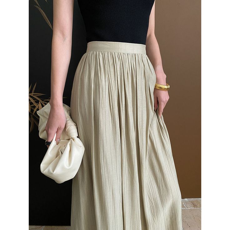 Pleated Textured A-Line Skirt Fabric: 85% Cotton+15% Nylon Size: S, M, L, Multiple Color Selections: Apricot  Season: Spring, Fall, Summer Casual Full-length Pleated Skirt, Chic Stretch Beige Pleated Skirt, Chic Beige Stretch Pleated Skirt, Summer Beige Pleated Maxi Skirt, Versatile Pleated Skirt For Summer, Versatile Pleated Skirt Bottoms For Summer, Beige Pleated Maxi Skirt For Summer, Stretch Beige Pleated Maxi Skirt, High Waist Beige Pleated Skirt For Summer