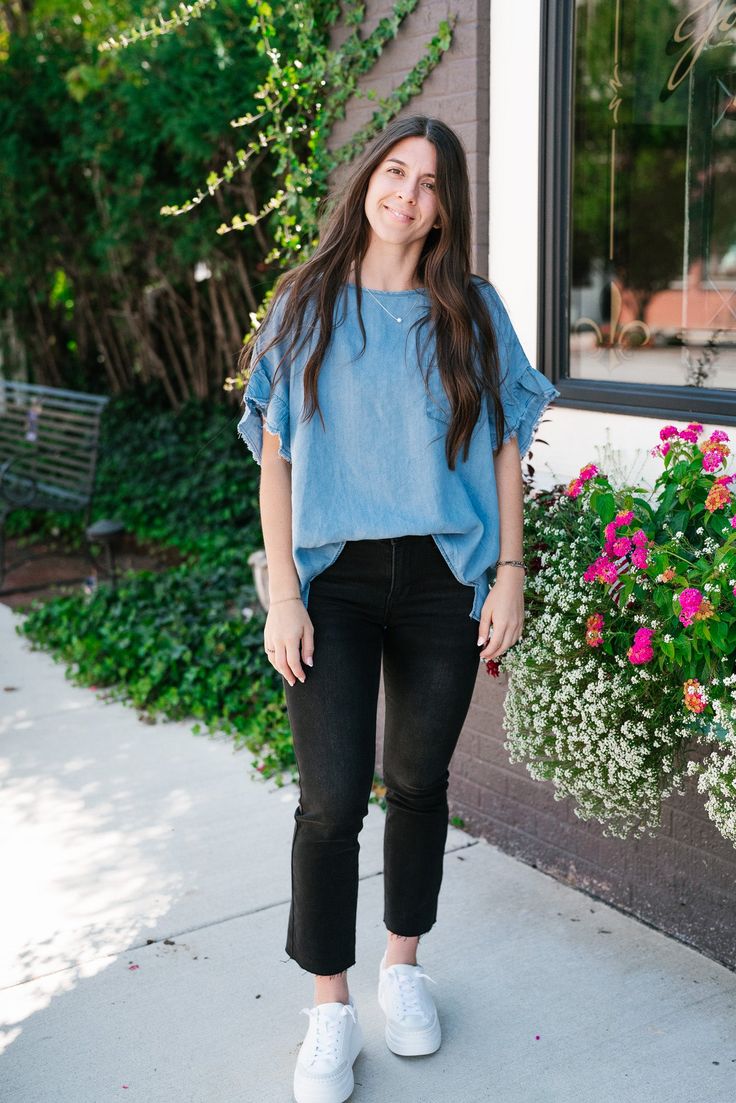 The Emily Denim Top is a casual, light blue denim top that offers a relaxed, laid-back vibe perfect for everyday wear. The fabric is soft and lightweight, making it comfortable and breathable for any season. The top features a simple round neckline and a single chest pocket, adding a touch of classic style. The slightly oversized fit and curved hemline enhance its relaxed look, making it easy to pair with jeans, shorts, or leggings. The Fabric: 100% Tencil Product details: Casual, relaxed fit. F Spring Light Wash Denim Top For Everyday, Relaxed Fit Washed Tencel Tops, Spring Everyday Light Wash Denim Top, Light Blue Relaxed Fit Denim Top For Spring, Trendy Light Wash Denim Top For Everyday, Relaxed Fit Light Wash Denim Top For Day Out, Relaxed Fit Washed Blue Chambray Denim Top, Casual Medium Wash Denim Top For Spring, Light Wash Relaxed Fit Denim Top