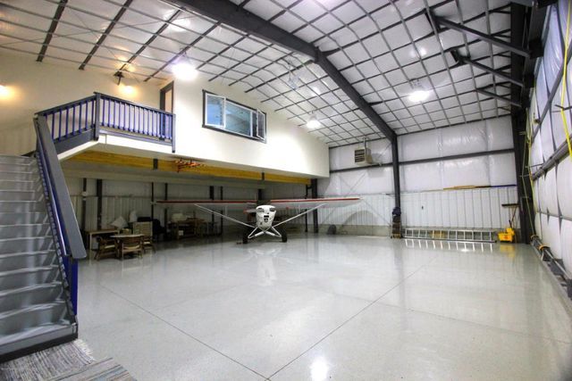 an airplane is parked in the middle of a building