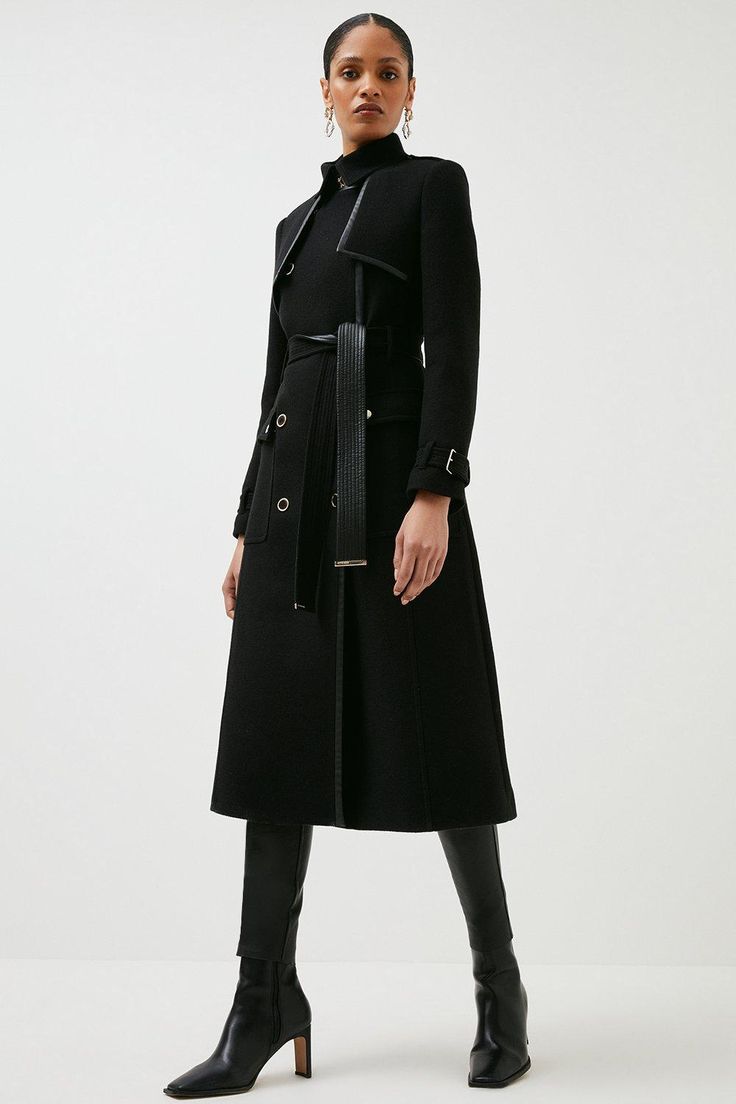 With Its Classic Hue, Double-Breasted Buttons And Piped Trims, This Luxe Italian Wool Coat Makes A Polished Partner For Cold Days. It Shows Off A Sophisticated High Neckline, Long Sleeves And Belted Trims For A Modern Military-Inspired Finish. Elegant Winter Outerwear With Belt Loops, Elegant Long Coat With Belt Loops, Luxury Belted Wool Coat, Luxury Belted Long Sleeve Outerwear, Luxury Long-sleeved Belted Outerwear, Elegant Long Coat With Belt Detail, Winter Workwear Outerwear With Belt Detail, Formal Winter Outerwear With Belt Detail, Winter Formal Outerwear With Belt Detail