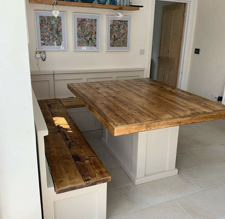 a kitchen table with two benches next to it