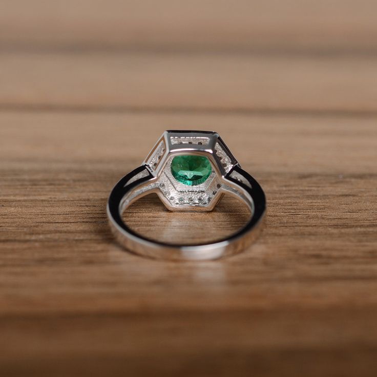 It is a genuine emerald ring(lab emerald). The emerald is 7mm*7mm round, weight about 1.29 carats. The basic metal is sterling silver and plated with rhodium. To change the metal to a solid gold (white/rose) or platinum is also available, please ask for a quotation if you want. You can also go to my shop Home for more elegant rings: https://www.etsy.com/shop/godjewelry?ref=hdr_shop_menu Emerald is May birthstone. More emerald rings: https://www.etsy.com/shop/godjewelry?ref=hdr_shop_menu&sect Anniversary Rings For Her, Emerald Wedding, Engagement Anniversary, Elegant Ring, Emerald Engagement Ring, Rings For Her, Emerald Ring, Birthstone Ring, Promise Rings