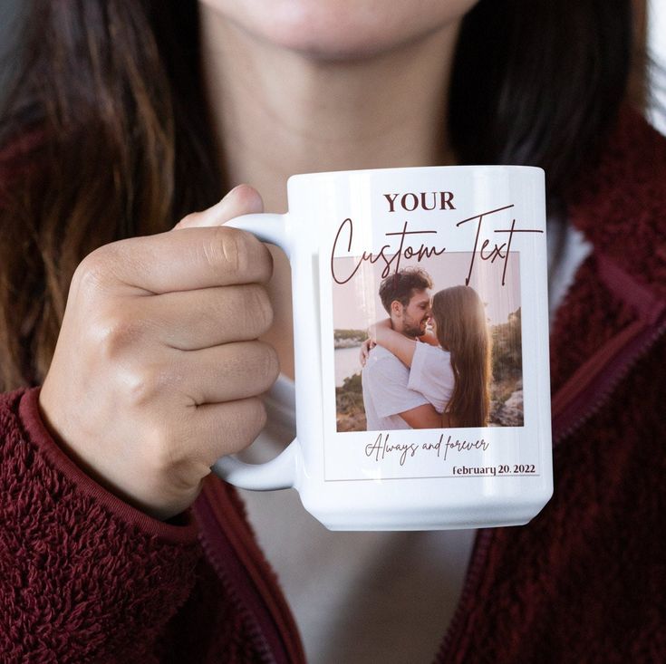 a woman holding a coffee mug with an image on it