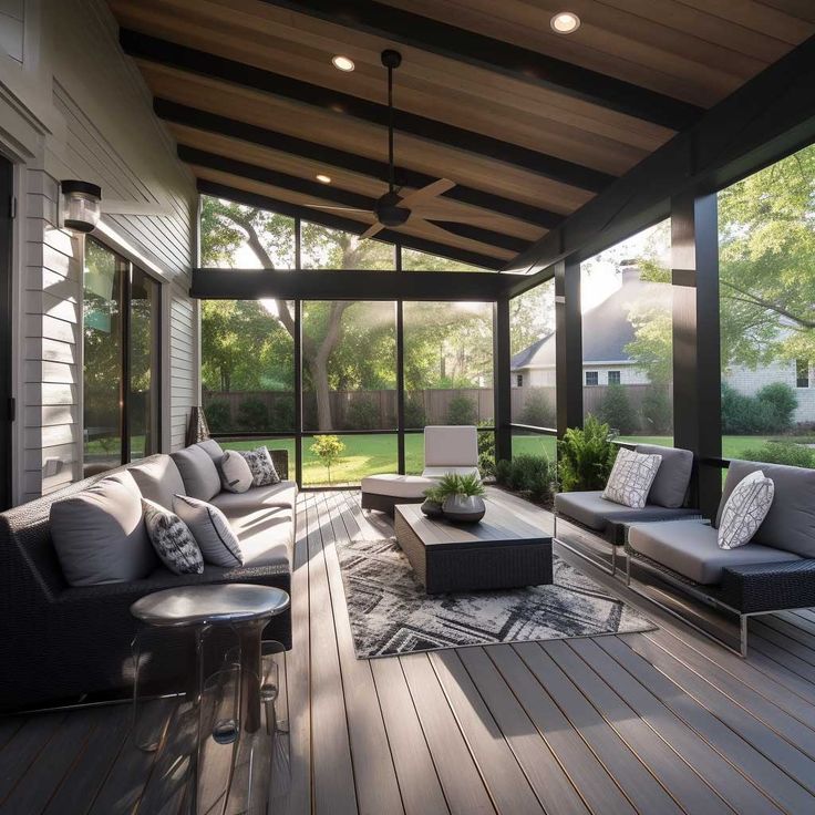 an outdoor living area with couches and chairs