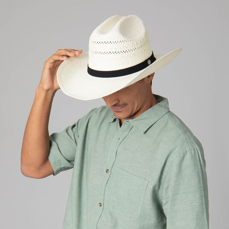 The Mens Ivory Cowboy is a stunning hat designed for those who want to stay stylish and protected from the sun. Crafted from 100% paper, this cowboy hat is a classic cattleman's crease cowboy with a 4" brim, crown ventilation, and faux suede band. Offering UPF 50+ sun protection, the Mens Ivory Cowboy is the perfect luxurious accessory for your next outdoor excursion. Features: Color: IvoryMaterials: 100% PaperSize: 59cmBrim Size: 4"Sun Protection: UPF 50+ White Western Fedora Panama Hat, White Western Style Panama Hat, White Western Panama Hat With Curved Brim, White Western Panama Hat With Short Brim, White Straw Hat For Ranch, White Country Hat In Toquilla Straw, Classic White Straw Hat For Rodeo, White Country Style Hat In Toquilla Straw, White Western Toquilla Straw Hat