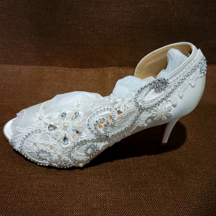 Gorgeous Satin Wedding Heels..Size 10..Crystals, Lace, Peep Toe..Never Worn..New With Box..Off White. .Heel Is 2.5 Inches..Beautiful!! Crystal High Heels For Wedding, Fitted Rhinestone Wedding Heels, Crystal Embellished Wedding Heels, Fitted Open Toe Wedding Shoes With Rhinestones, Fitted White Wedding Shoes With Rhinestones, Embellished Lace Wedding Shoes, Embellished Fitted Wedding Shoes With Closed Toe, White Embellished Heels For Wedding Reception, Rhinestone Wedding Heels