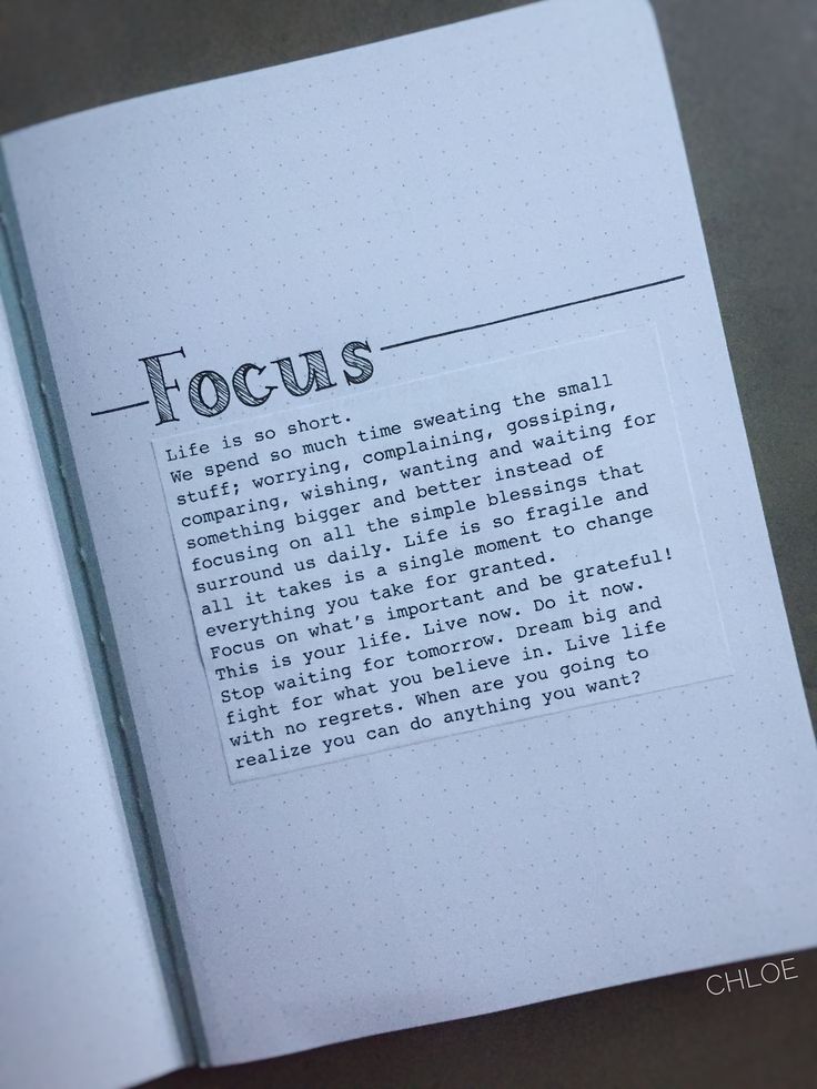 an open notebook with the words focus written in black and white on top of it