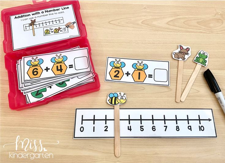 a number line game with matching cards and pencils