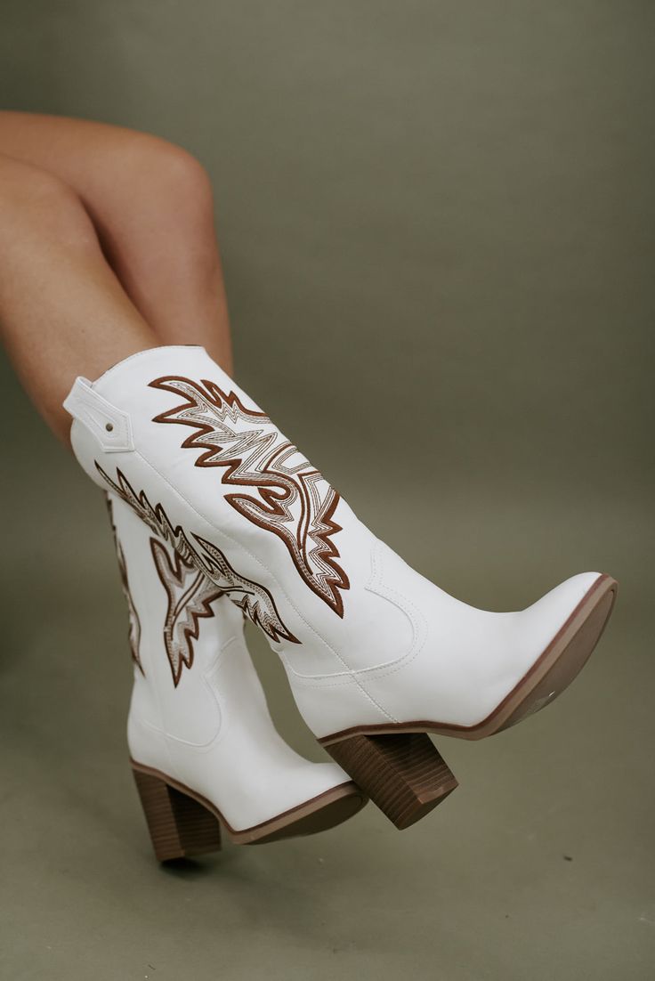 Western Knee-high Boots For Spring, Western High Heel Knee-high Boots, White Boots For Western-themed Events, White Boots For Western-themed Fall Events, Spring Season Rodeo Knee-high Boots With Snip Toe, Western Wide Calf High Heeled Boots, White Western Knee-high Boots With Wide Calf, White Wide Calf Western Knee-high Boots, Spring Rodeo Knee-high Boots With Snip Toe