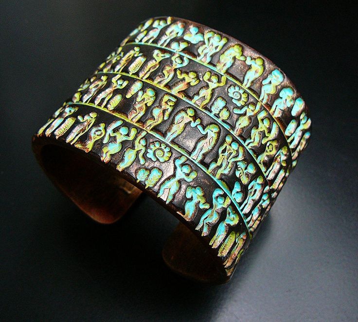 this is an image of a cuff with elephants on it