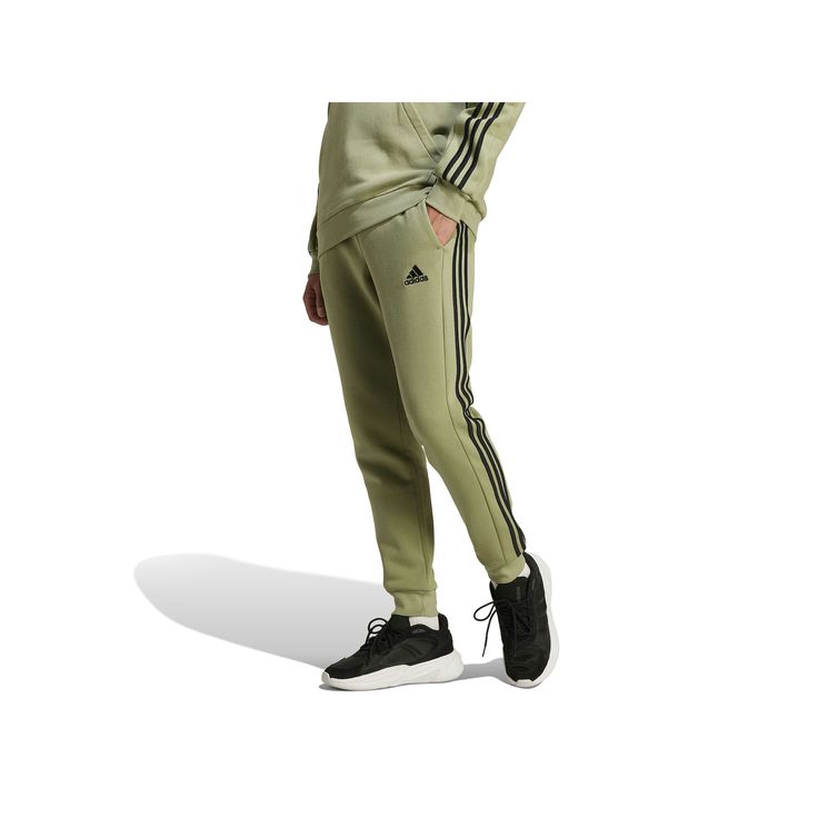 Whether it's a chilly day or you just want extra comfort, these adidas pants are your pick. Made from a soft cotton blend in fluffy fleece, they welcome all-day wear without a second thought. The mid-rise fit is finished with an elastic waist, and the legs taper to ribbed cuffs that let you show off your shoes.Click on this MEN'S GUIDE to find the perfect fit and more! TECHNOLOGIES & FEATURES Fleece 2 side pockets, 1 mobile pocket Ribbed cuffsFIT & SIZING 30-in. inseam Midrise sits above the hip Adidas Relaxed Fit Sweatpants Sportswear, Adidas Relaxed Fit Sweatpants In Sportswear Style, Cotton Activewear With Three Stripes In Relaxed Fit, Casual Cotton Activewear With Three Stripes Branding, Adidas Relaxed Fit Sweatpants With Three Stripes, Adidas Relaxed Fit Athleisure Joggers, Branded Relaxed Fit Sportswear Joggers, Cotton Relaxed Fit Pants With Adidas Logo, Sporty Relaxed Fit Sweatpants With Three Stripes