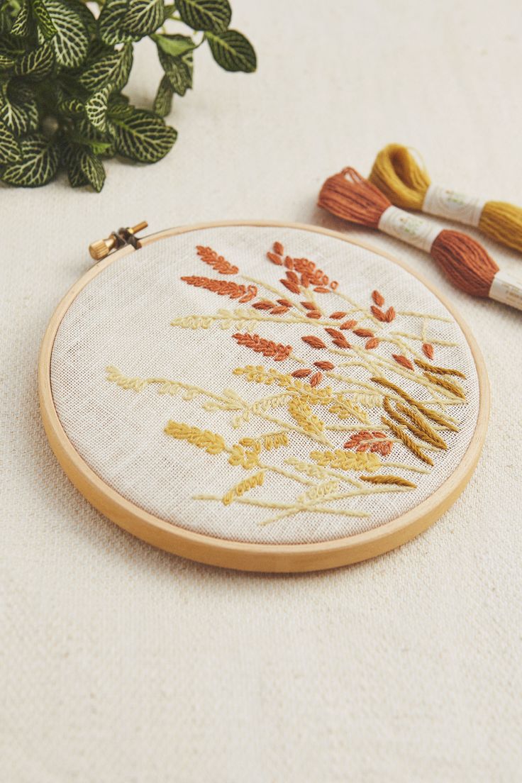 the embroidery is on and next to some plants