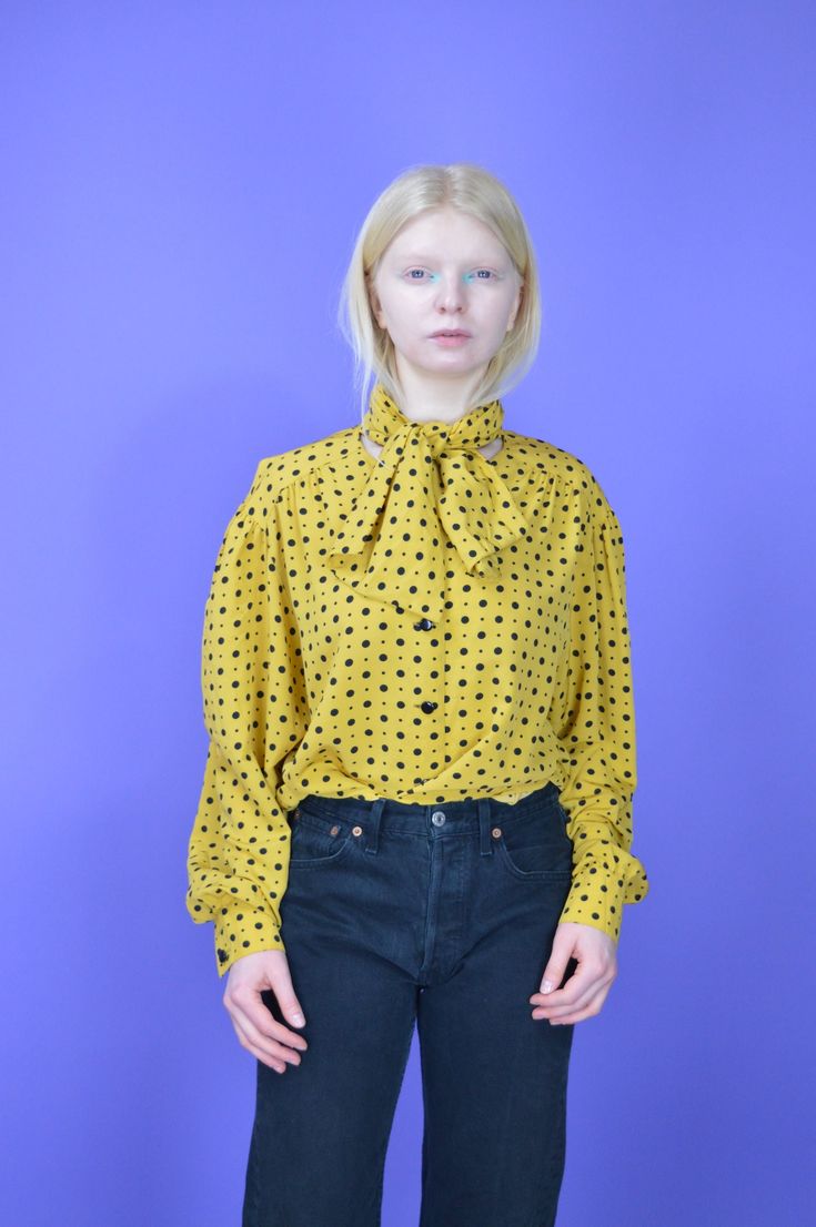 Vintage yellow classic 80's long sleeve blouse {W339} PRODUCT INFO: Material - 100% POLYESTER / Size tag on item - XL / FULL LENGTH - 77 CM / 30 INCH / PIT TO PIT - 59 CM / 23 INCH / Our model is 170 CM and normally wears a size S INFO: Due to item's vintage condition, the original tag might not show the true size. If you have any questions about this product or shipping just drop us a message and we will get back to you as soon as possible. CONDITION: Please note that Hanger Vintage sell true v Yellow Long Sleeve Tops For Fall, Yellow Fitted Shirt For Fall, Fitted Yellow Shirt For Fall, Retro Long Sleeve Winter Shirt, Vintage Long Sleeve Blouse For Fall, Long Sleeve Blouse For Vintage Fashion In Fall, Long Sleeve Blouse For Fall Vintage Fashion, Vintage Fashion Long Sleeve Summer Blouse, Vintage Fashion Summer Long Sleeve Blouse