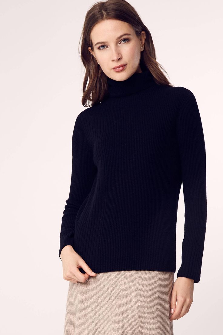 A timeless turtleneck sweater that will become your go-to seasonal style. Made from a blend of cashmere, merino wool and nylon, the turtleneck is seamless, allowing the garment to contour and shape to your body with more freedom of movement. Fit is slightly loose for an effortless, and chic, sharp look. Designed by a mother and daughter duo committed to timeless and easy to wear apparel, natural fibers and sustainable production. 5% Cashmere, 50% Merino Wool, 45% Nylon S/M Length is 34", M/L Len Ribbed Cashmere Turtleneck For Work, Classic Black Turtleneck For Fall, Ribbed Cashmere Turtleneck For Fall, Cashmere Turtleneck For Layering, Black Merino Wool Turtleneck For Fall, Black Cashmere Turtleneck For Fall, Elegant Black Turtleneck For Fall, Classic Black Turtleneck, Solid Cashmere Turtleneck For Workwear