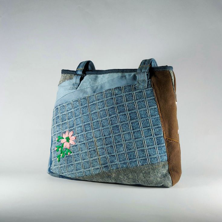 hand embroidered flower tote bag, floral tote bag aesthetic, shoulder bag for women and girls ,upcycled denim handbag ,weekender tote bag - only one of a kind, hand embroidered handmade blue jeans, patchworked denim  shoulder bag  - extremely durable and smooth zipper - very roomy can carry lots of things and still keeping its cute and elegant look from outside. with two large inner pockets ; one of them is zippered to keep your most used items easily reachable - two hidden front pockets and thr Eco-friendly Upcycled Bags For Daily Use, Daily Use Denim Blue Recycled Denim Bag, Handmade Rectangular Recycled Denim Bag, Blue Recycled Denim Bags, Upcycled Shoulder Bag In Recycled Denim, Upcycled Recycled Denim Shoulder Bag, Upcycled Denim Travel Bag, Upcycled Shoulder Bag For Daily Use, Denim Travel Bag With Upcycled Material