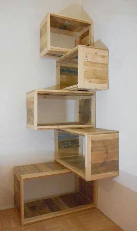 the shelves are made out of wooden boxes