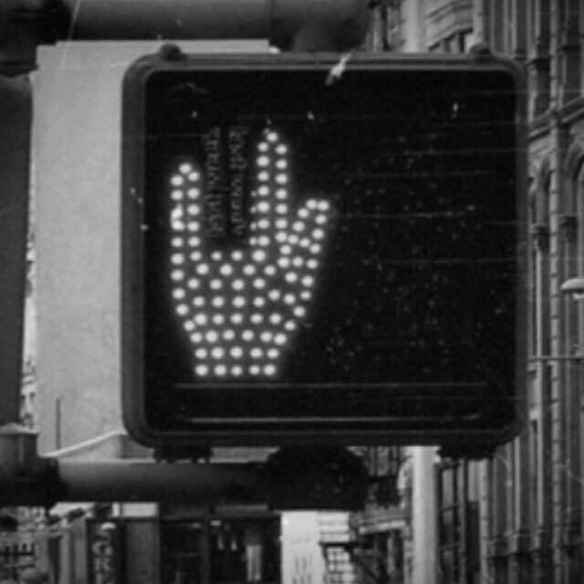 a black and white photo of a hand signal