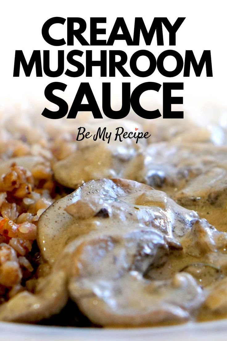 a white plate topped with mushrooms covered in gravy