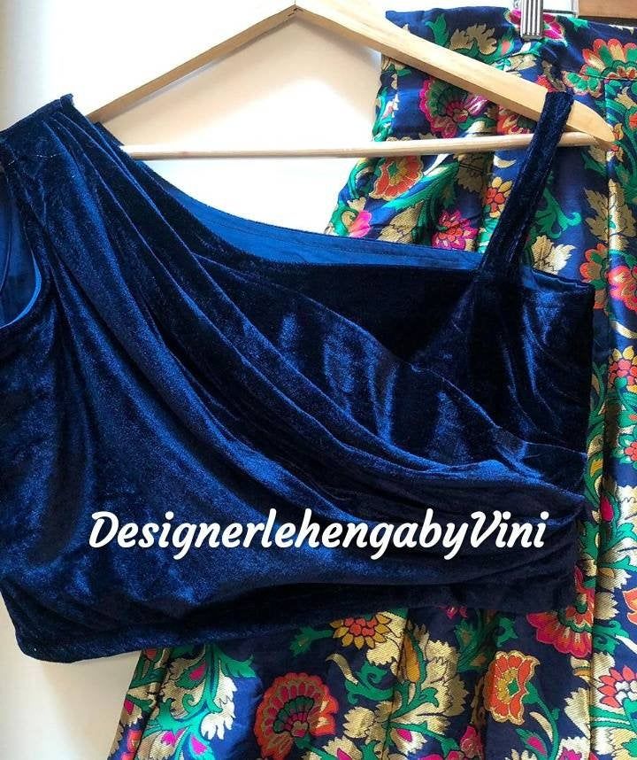 Custom made velvet crop top with banarasee lehenga perfect for all festive and wedding occasions. Size- Custom made as per your size so message us for the size chart. Manufacturing time- 10 days All size available. Fabric details- Top/blouse- Velvet Skirt/lehenga- Banarasee Velvet Lehenga For Party, Velvet Anarkali Choli For Parties, Anarkali Velvet Choli For Party, Anarkali Style Velvet Choli For Parties, Velvet Sharara For Party And Festivals, Festive Velvet Choli For Party, Bollywood Style Velvet Party Set, Velvet Party Sets With Traditional Drape, Festive Velvet Party Choli