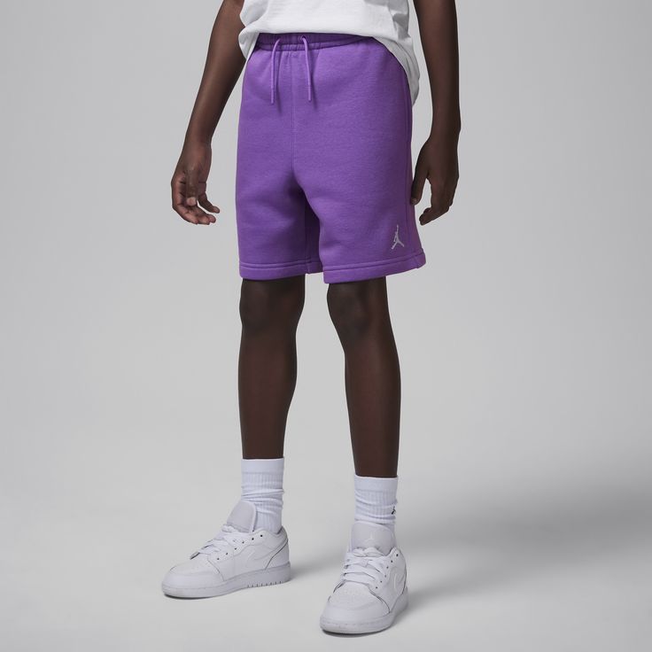 These shorts are a classic silhouette made of soft cotton/poly fleece that feels smooth on the outside and soft on the inside. The stretch waistband with drawcord provides a comfy fit and pockets on the sides and back provide spots for you to stash small items. Pair with the Jordan MJ Brooklyn Fleece Pullover for a coordinated look. Casual Fleece Shorts For Loungewear, Casual Fleece Shorts With Pockets, Drawstring Shorts For Playwear In Spring, Drawstring Shorts For Spring Playwear, Spring Drawstring Shorts For Playwear, Casual Fleece Sports Shorts, Cotton Sportswear Shorts For Playwear, Sporty Cotton Sweatpants For Playwear, Sporty Purple Cotton Sweatpants